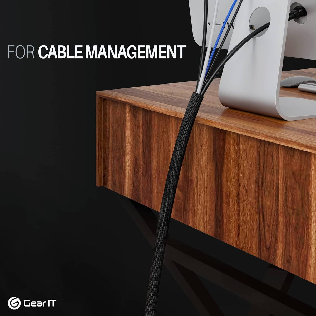 Black cable sleeve routed along a wooden desk edge for cable management
