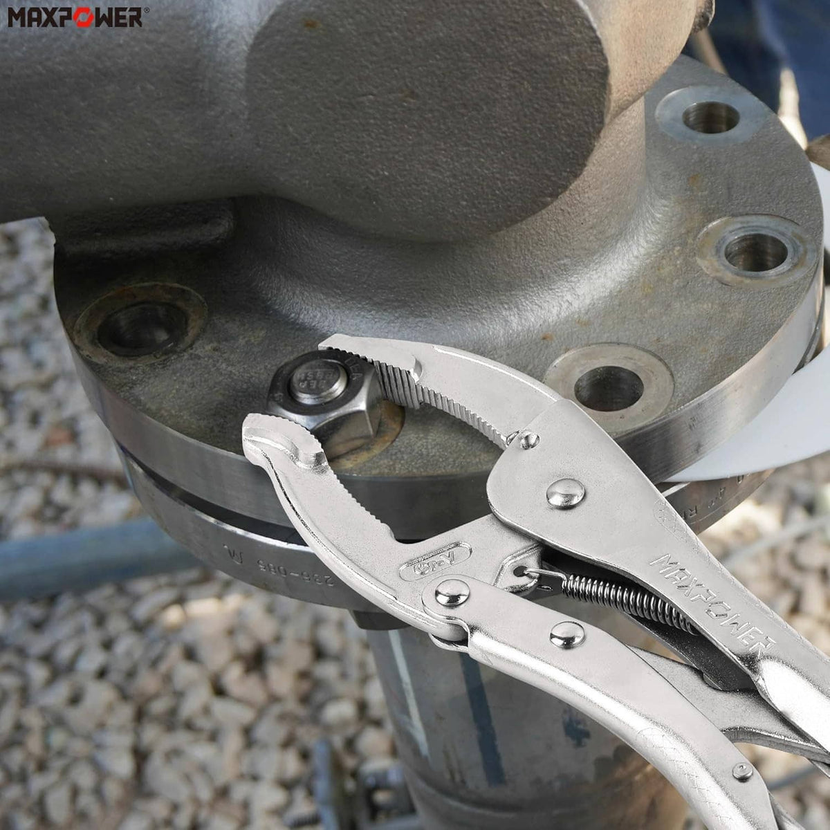 Curved jaw locking pliers clamped on an industrial pipe connection