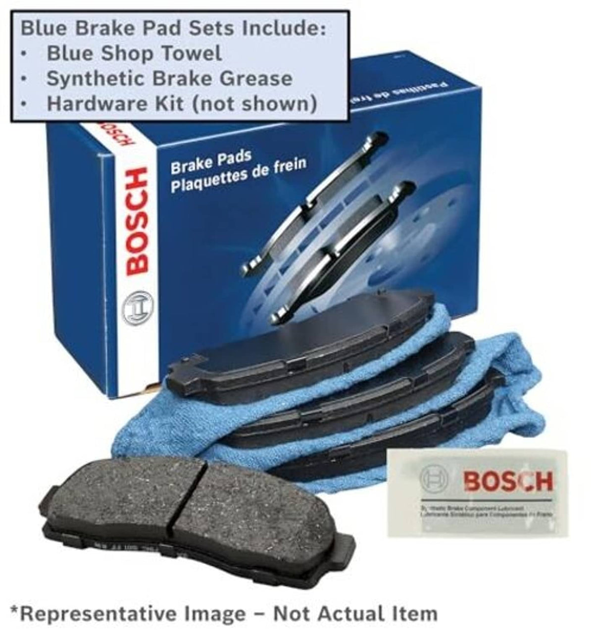 Brake pad set with hardware kit, showing black pads, blue shop towel, and grease