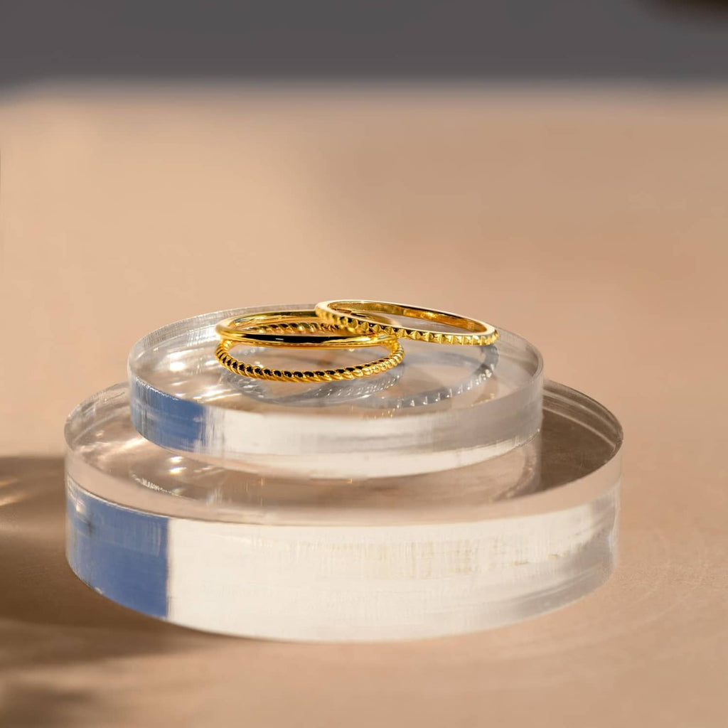 Gold-plated stacked ring set with oval and dotted textured details