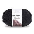 Skein of Bernat Blanket yarn in dark gray/coal, chunky ribbed texture