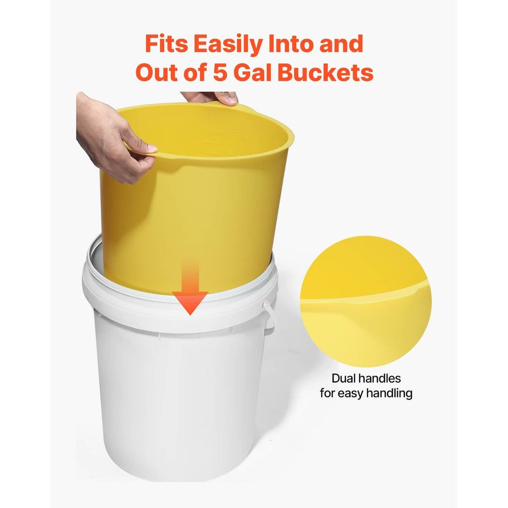 Yellow silicone liner being inserted into a white 5-gallon bucket for easy fit