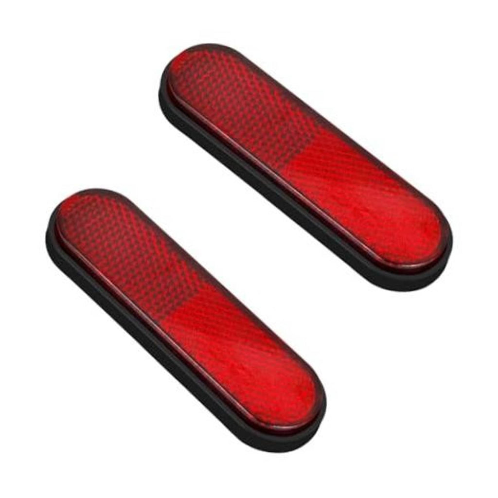 Red oval reflective motorcycle reflector sticker with black border and textured surface