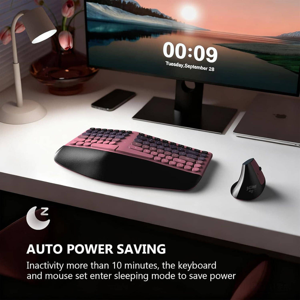 Pink and black wireless split curved keyboard with wrist rest and wireless mouse