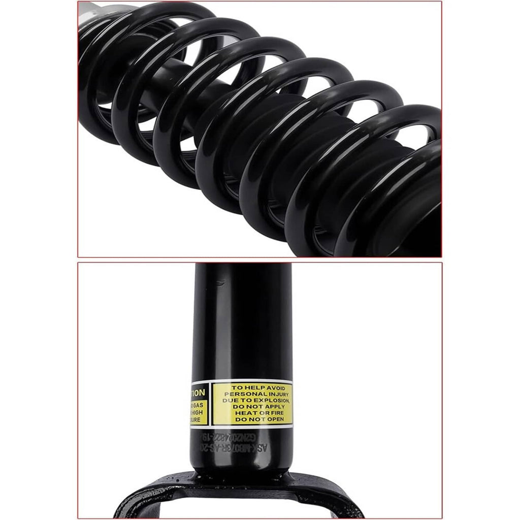 Close-up of black coil spring and shock absorber body with warning label
