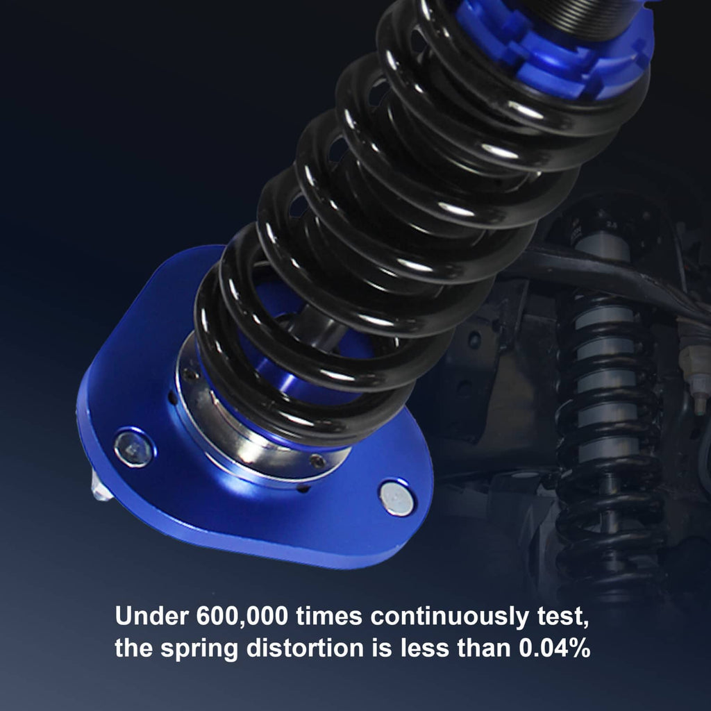 Close-up of blue coilover top hat and black coil spring on suspension strut