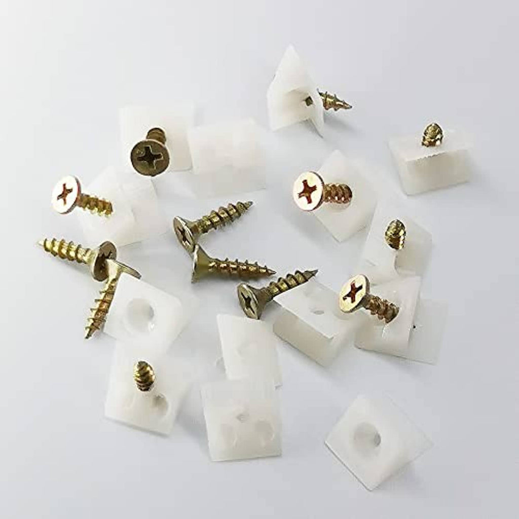 White plastic wedge anchors with attached gold screws for drawer repair kit