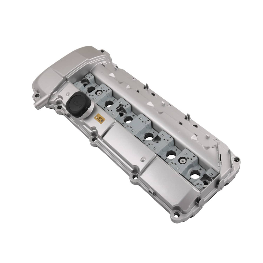 Light gray aluminum valve cover with spark plug openings and black oil cap
