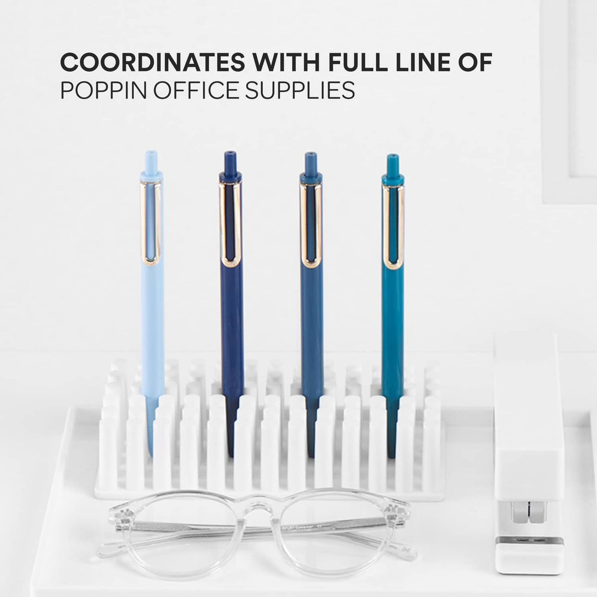 Four retractable gel pens in assorted blue shades with gold clips, fine point