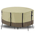 Beige round patio table cover with black trim and buckle-style securing straps