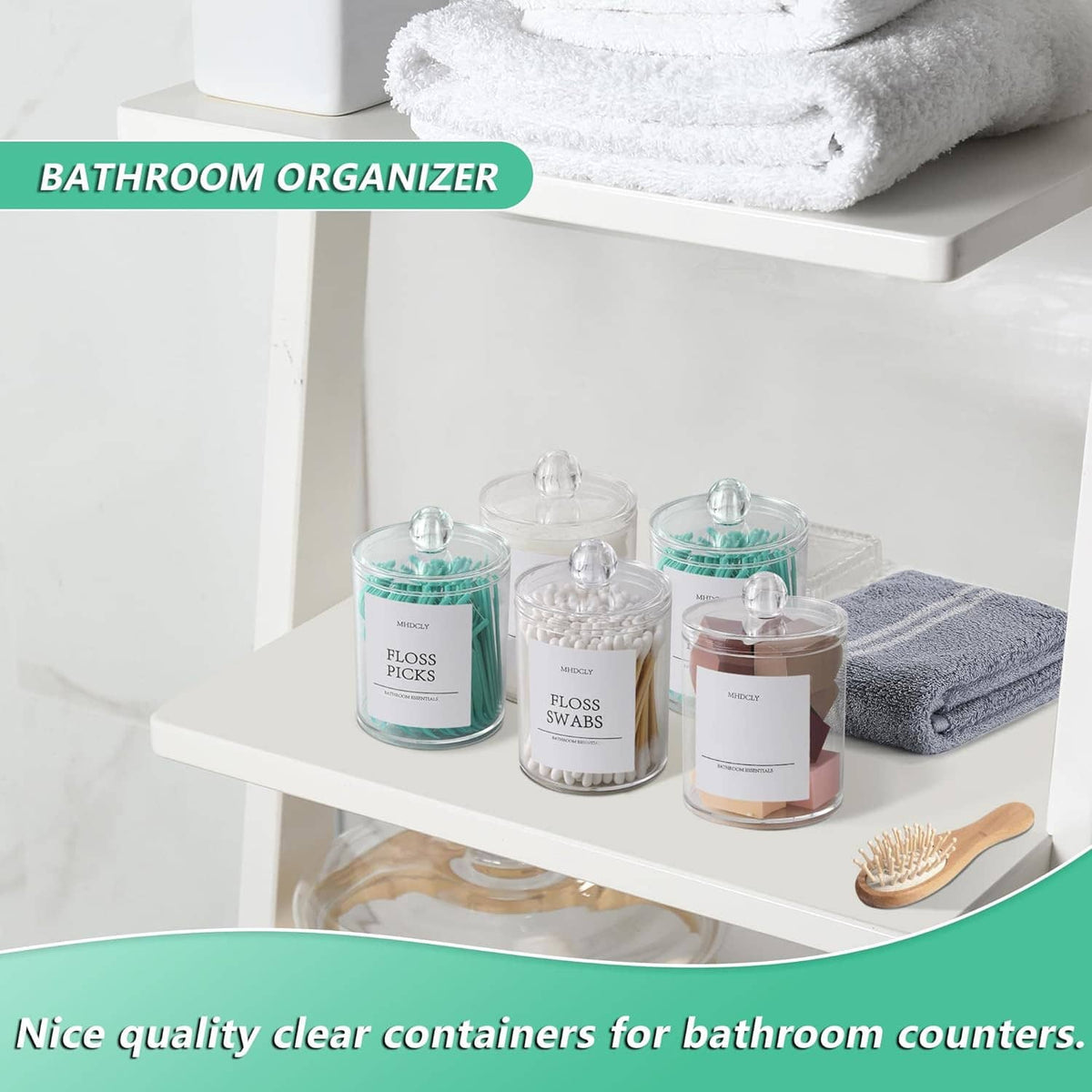 Set of clear bathroom organizer jars with round lids for floss picks and cotton essentials