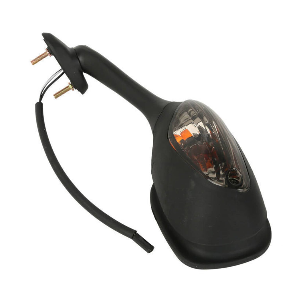Close-up of black motorcycle rearview mirror with amber turn signal lens and mounting stem