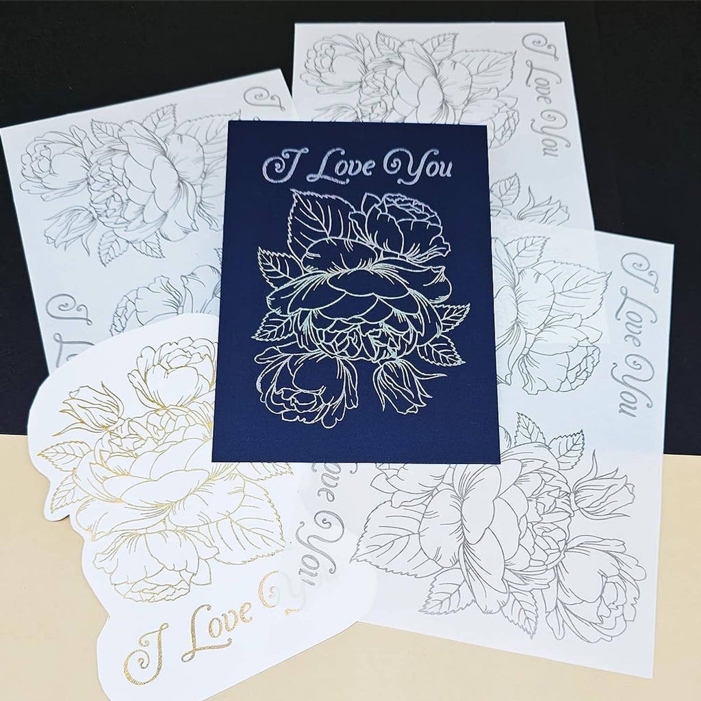 Stacked floral “I Love You” foil transfer sticker sheets in navy and light colors