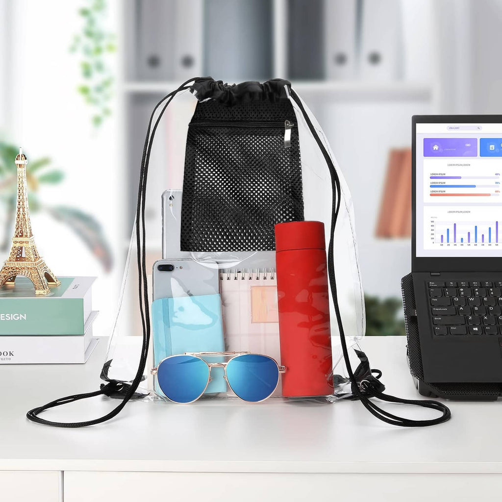 Black clear drawstring bag with front mesh pocket, filled with phone, sunglasses, toiletries