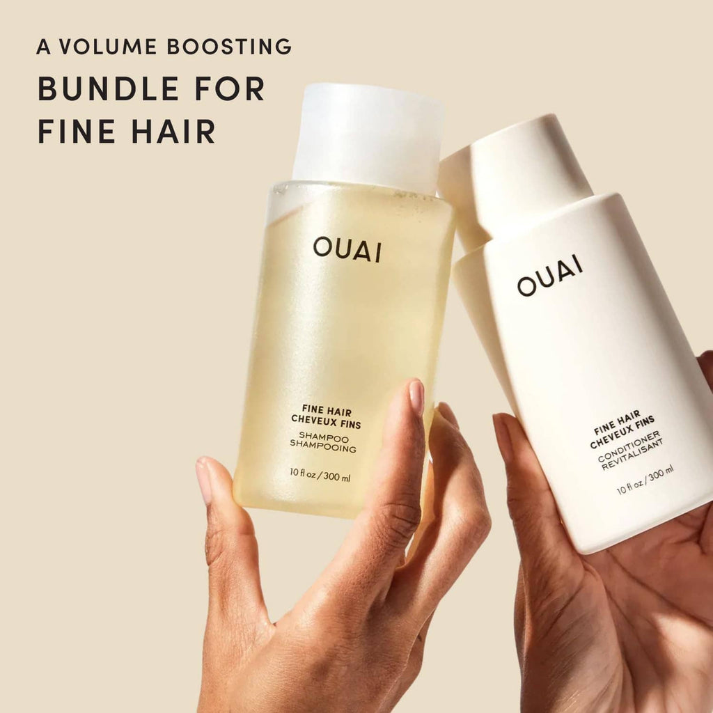 Fine hair shampoo and conditioner set, OUAI bottles held in hands—gold and white.