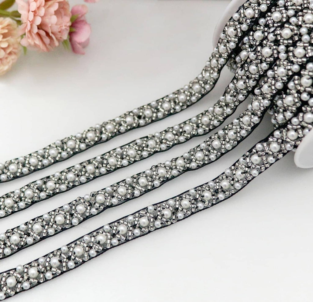 Black lace ribbon trim with rows of pearl beads and silver rhinestone accents