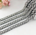 Black lace ribbon trim with rows of pearl beads and silver rhinestone accents