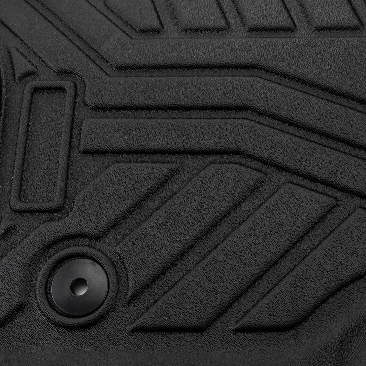 Black TPE floor mat liner with raised channels and round anchor grommet.