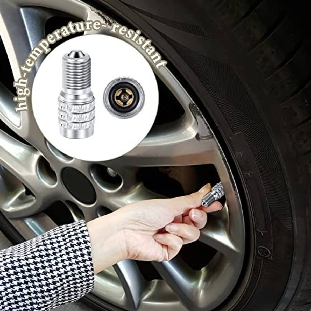 Hand installing chrome double valve tire stem cap on a car wheel valve