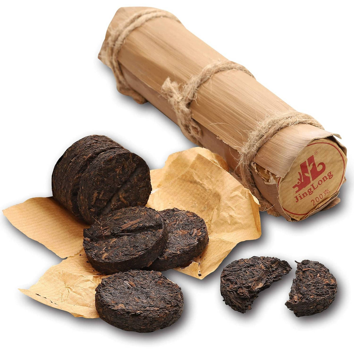 Ripe pu-erh tea in bamboo leaf tube with dark tea rounds and torn wrapper