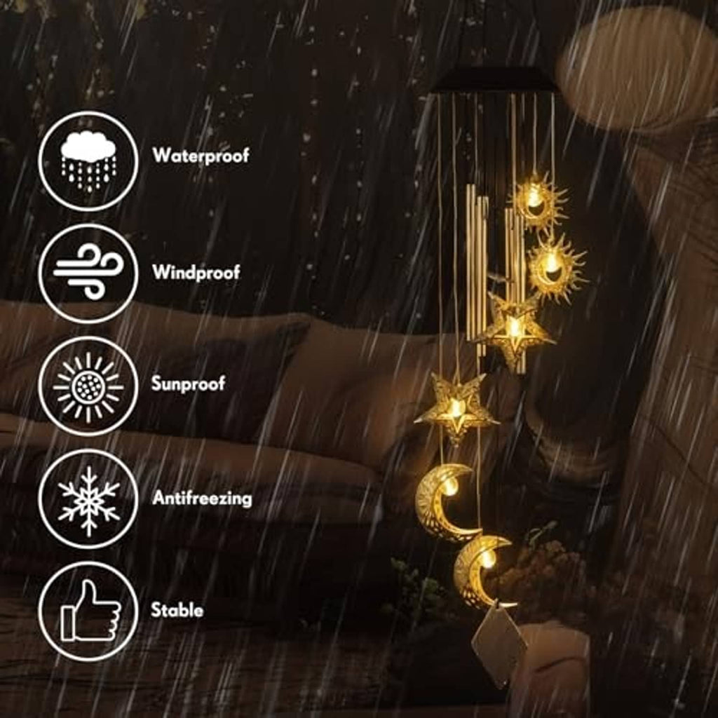 Wind chime solar lights with warm glowing sun and moon ornaments suspended on rods