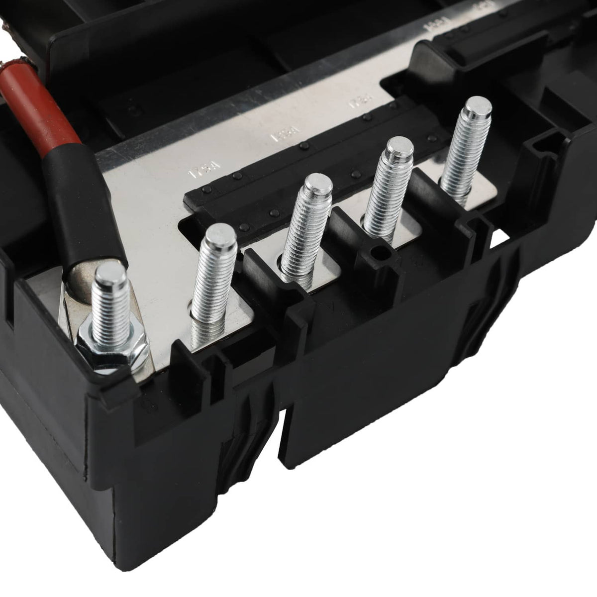 Battery fuse block top view with rows of metal posts and black plastic base