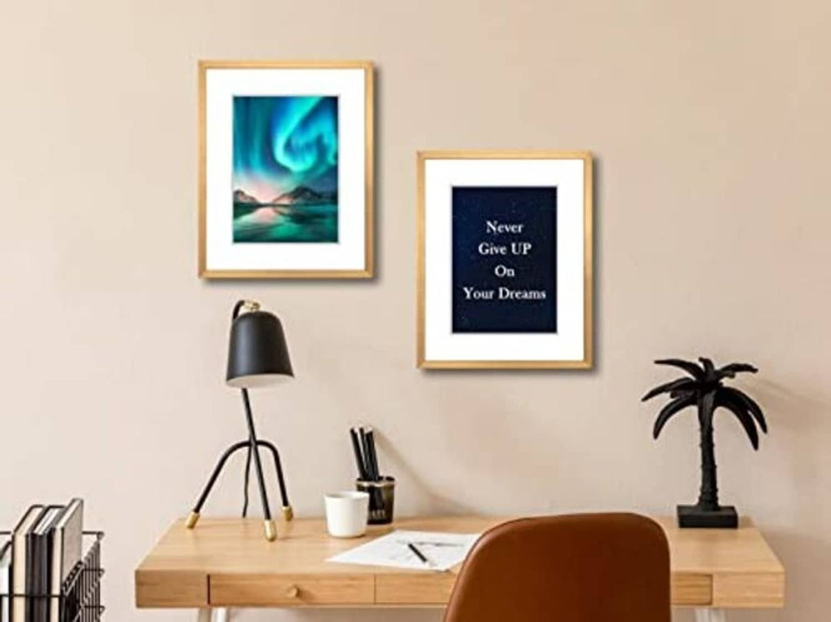 Two bronze 8x10 picture frames with real glass above a console table, one photo each