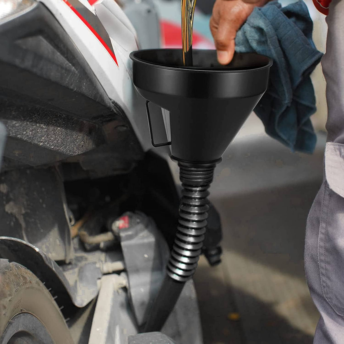 Black long-neck oil funnel with ribbed spout and handle for car engine filling