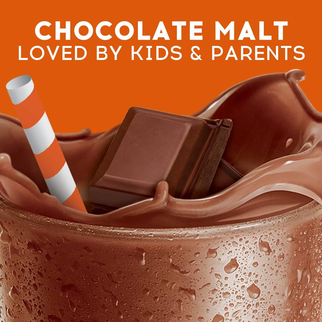 Chocolate malt drink in a clear glass with frothy surface, chocolate pieces, striped straw