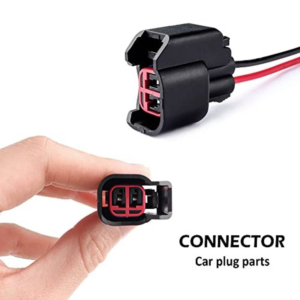 Fuel injector connector plug held in hand, gray housing with red port opening and wiring