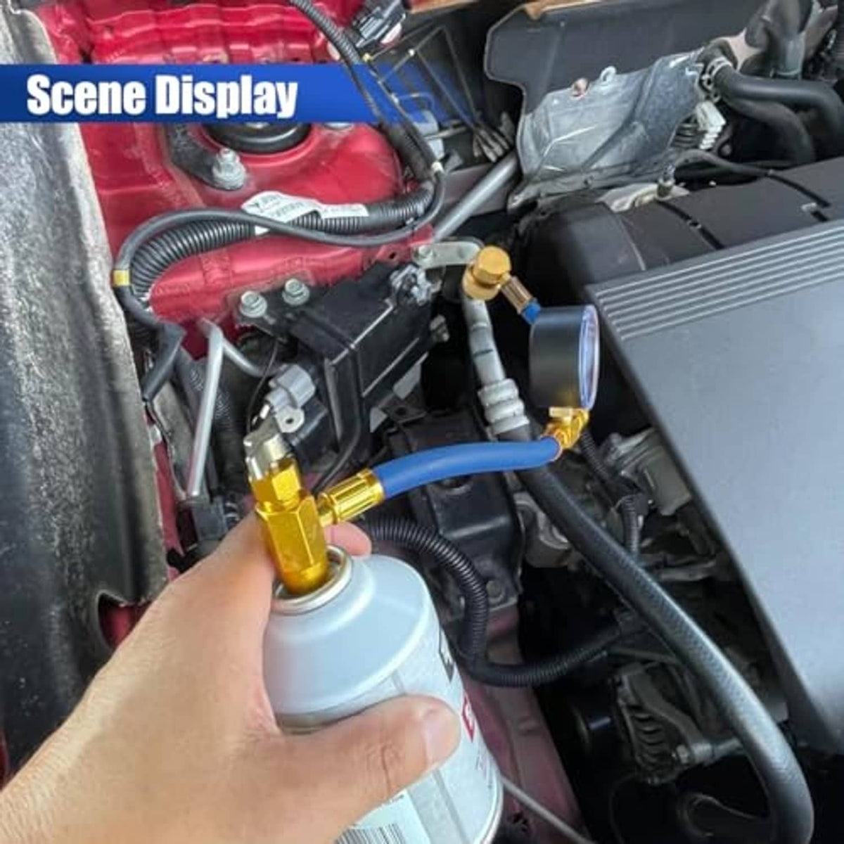 Car AC charging hose connected under hood with blue line and gold pressure fitting