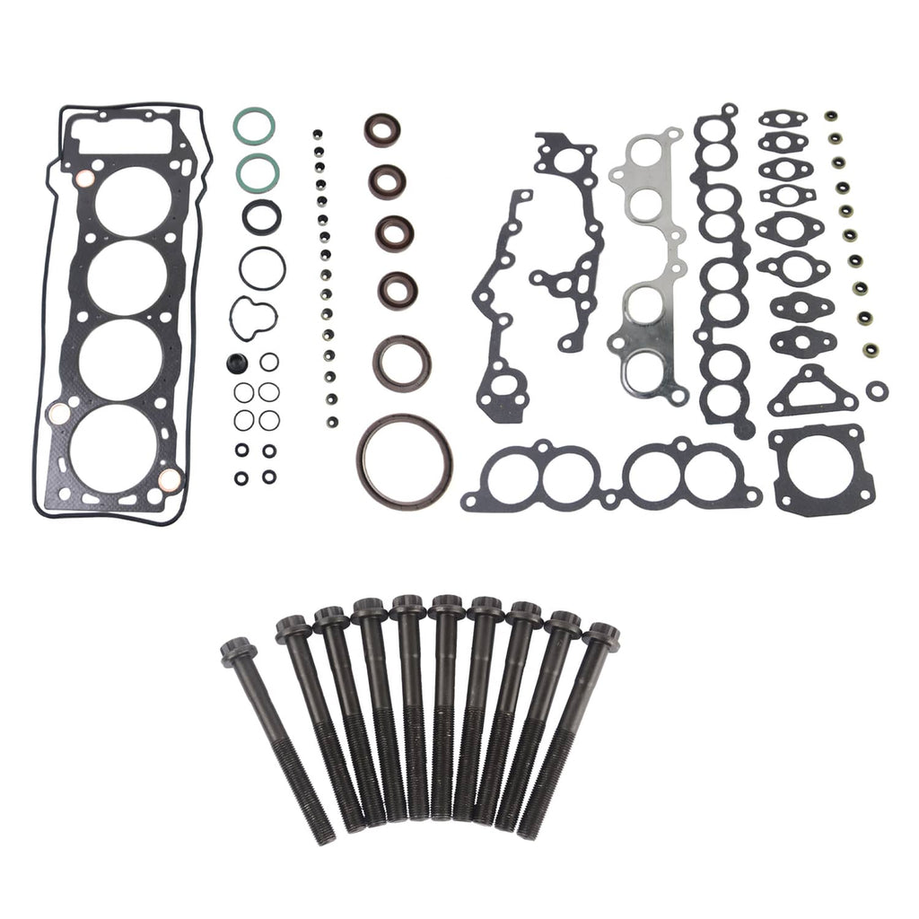 Engine head gasket set with bolts, laid out: gaskets, washers, rings, and hardware.