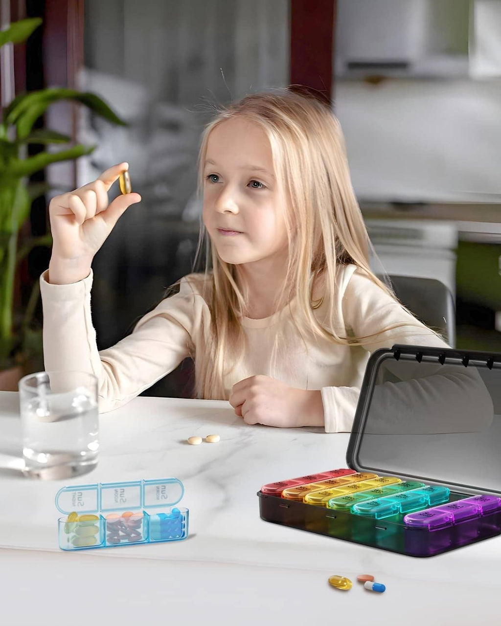 Weekly pill organizer on table with colorful day compartments and open clear lid
