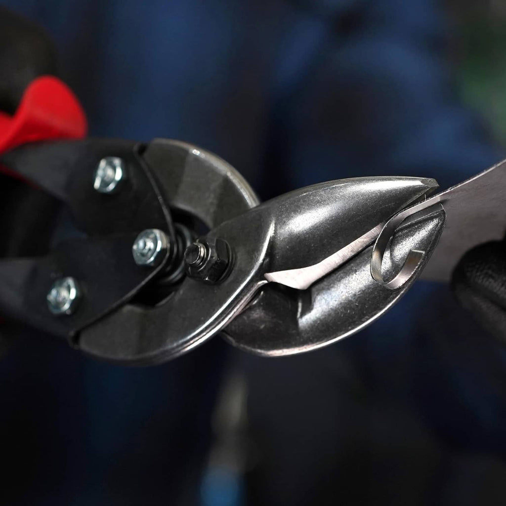 Close-up of aviation snip blades and pivot hardware on red-and-black tool