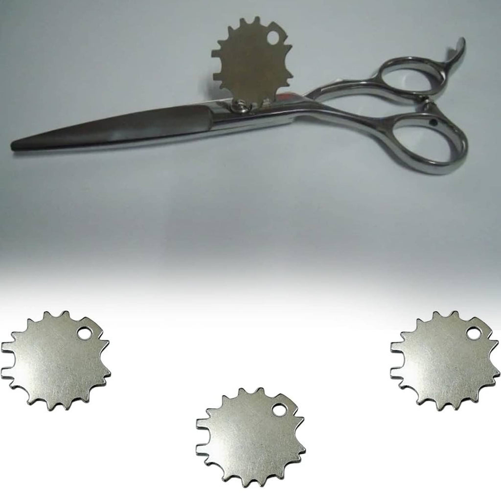 Silver scissors with small silver tension adjuster key discs shown nearby