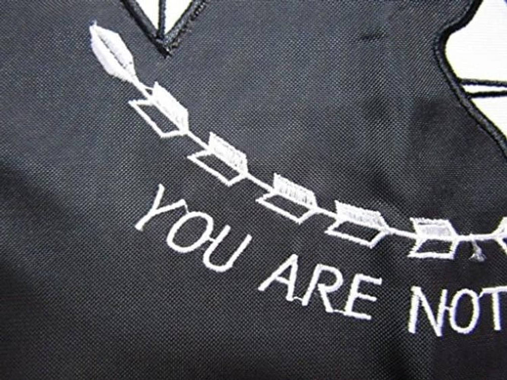 Close-up of embroidered POW*MIA banner text reading "YOU ARE NOT FORGOTTEN"