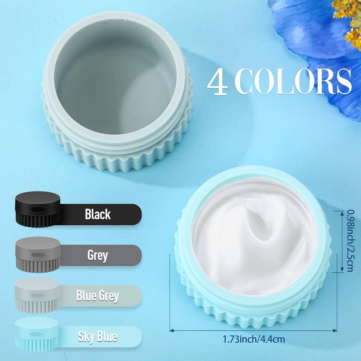 Four silicone travel cream jars in black, grey, blue-grey, and sky blue with open lid