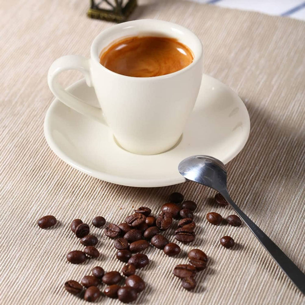 White porcelain espresso cup and saucer with espresso inside
