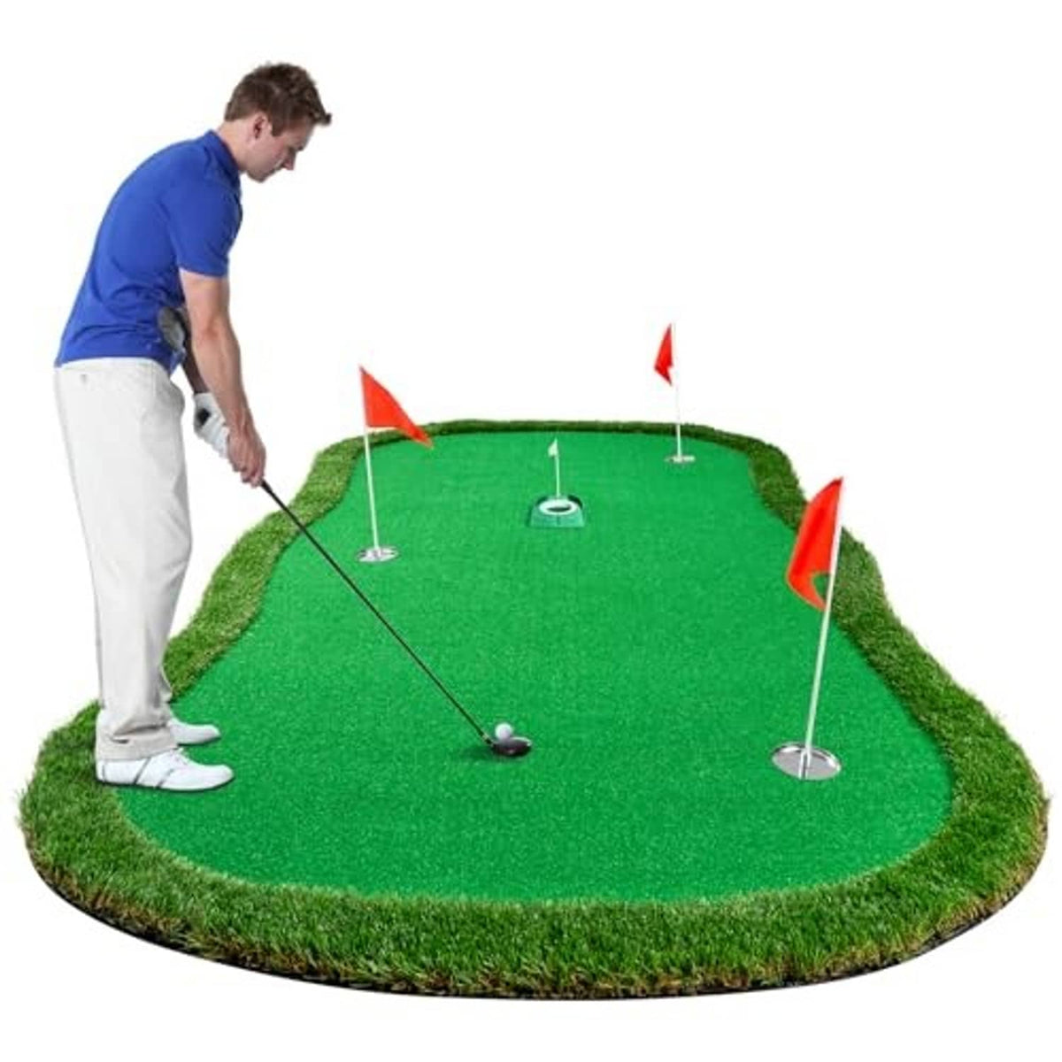Green artificial golf putting green mat with four cup flags and a rolling golf ball