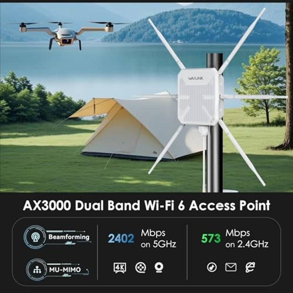 White outdoor Wi‑Fi extender on a pole with four antennas in a garden