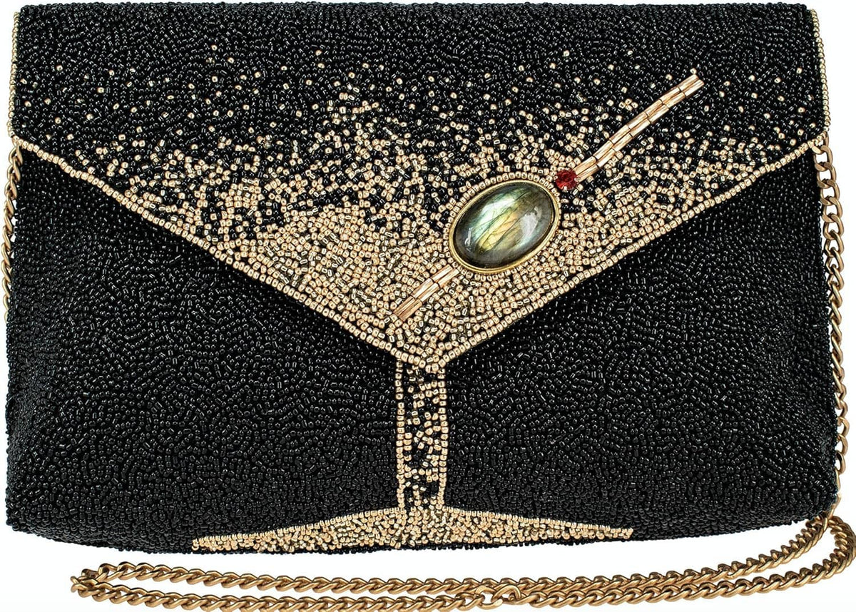 Black beaded crossbody clutch with gold diamond panel, oval gem clasp, and chain strap