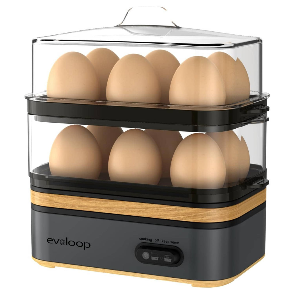 Gray electric 12-egg cooker with clear lid and stacked steaming trays