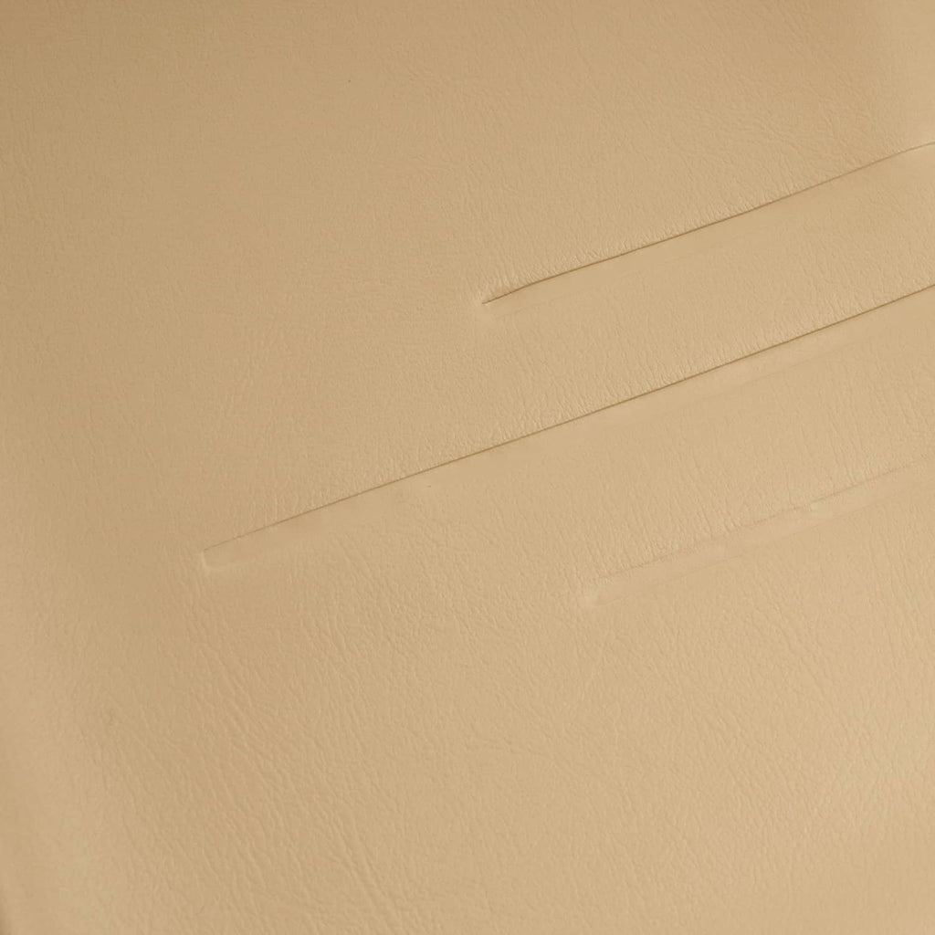 Tan seat back cover close-up, embossed seam and fine texture