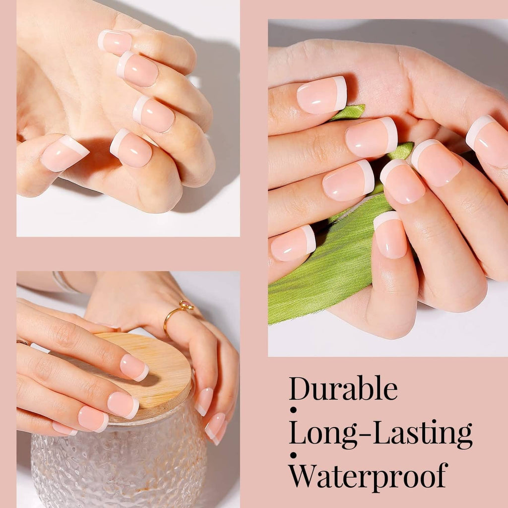 Pink short press-on nails with white French tips on fingers, glossy finish