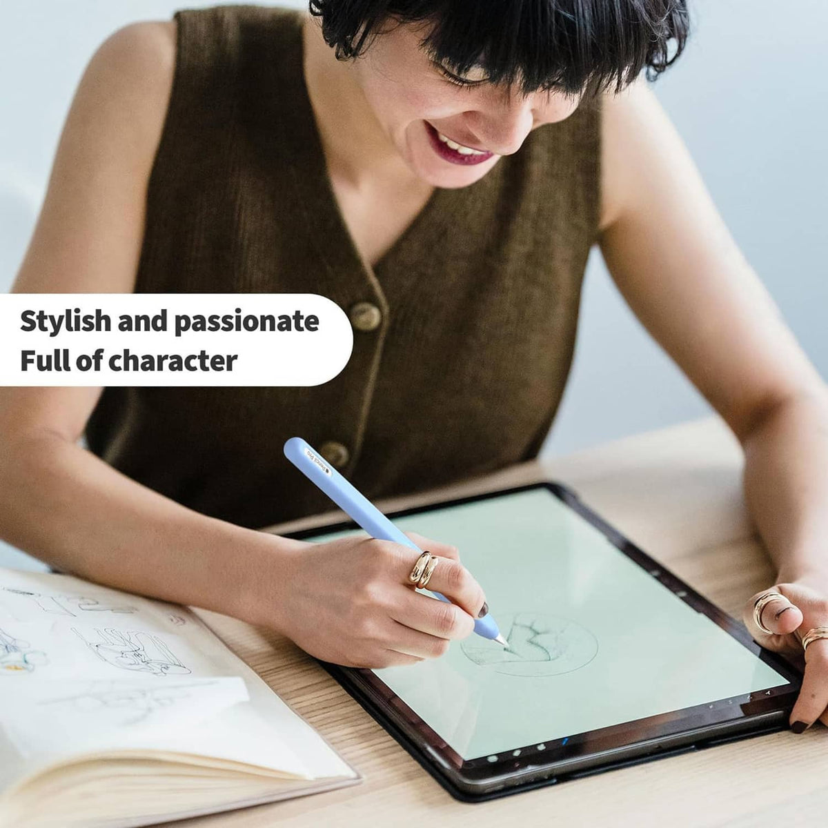 Blue protective silicone stylus cover in hand writing on a tablet