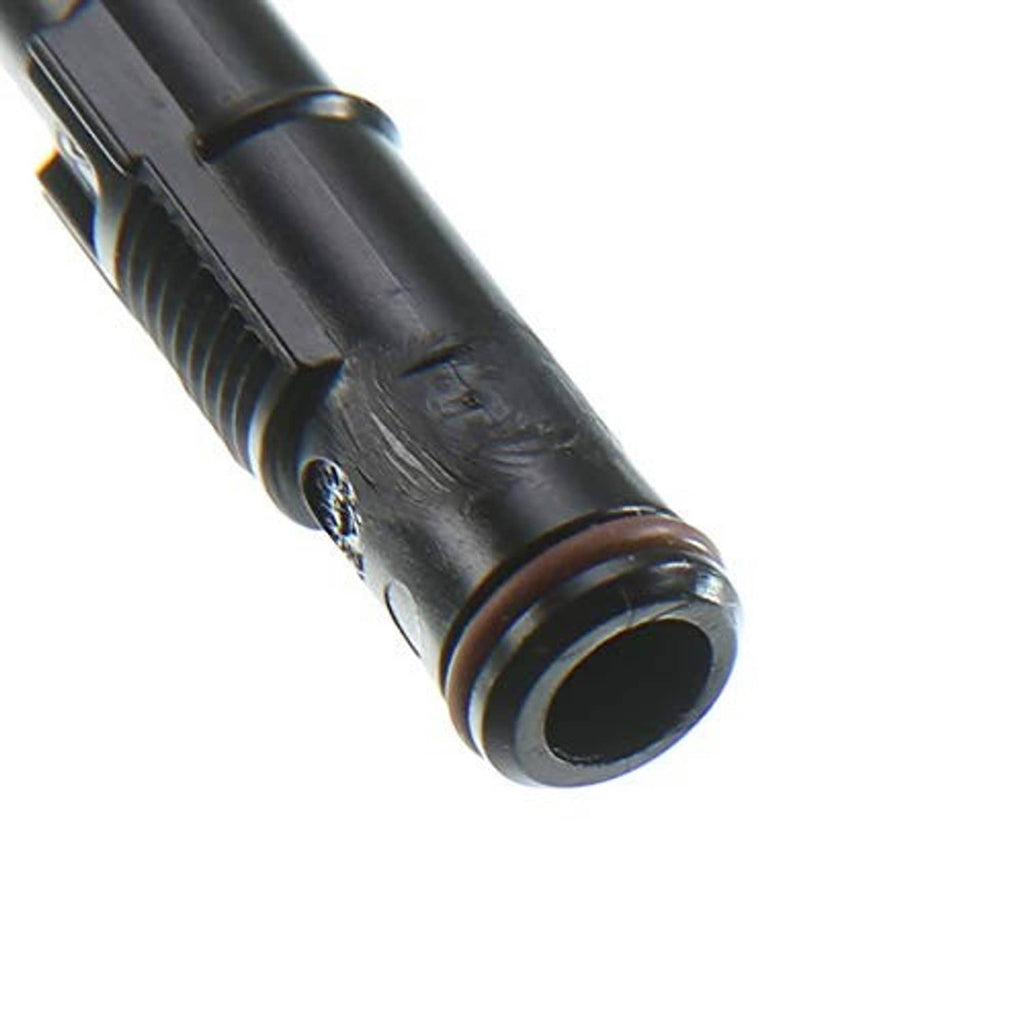 Close-up of headlight washer nozzle tip, black plastic with round outlet opening