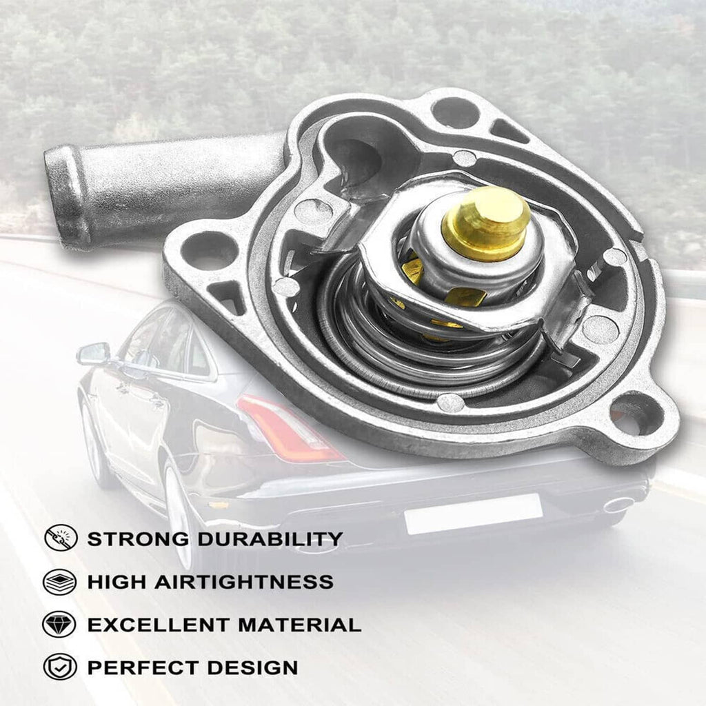 Thermostat housing assembly with spring coil and gold-colored valve stem