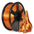 Copper silk PLA filament spool with loose strand and coiled filament sculpture