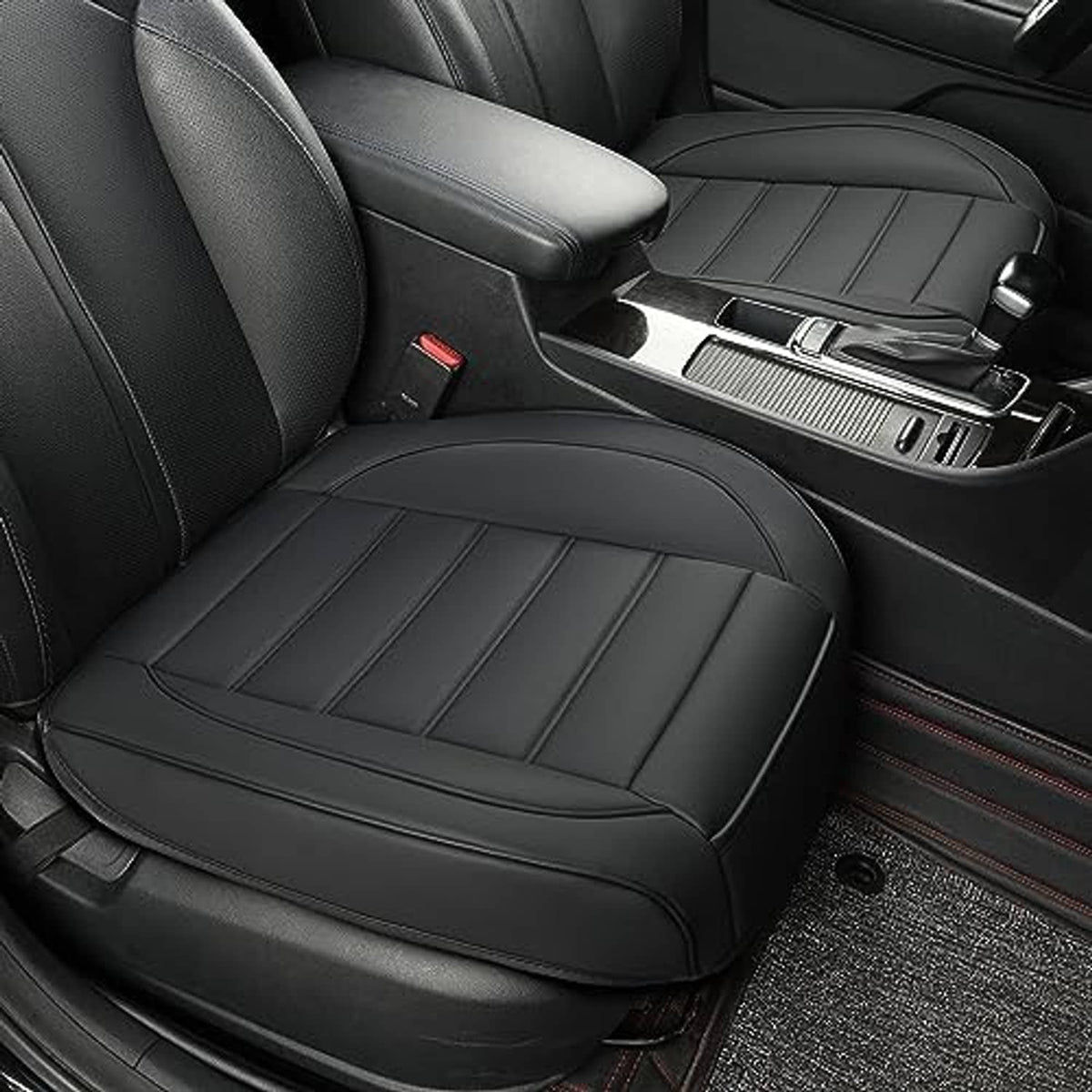 Black front passenger seat bottom cover with stitched quilted panels and contoured padding