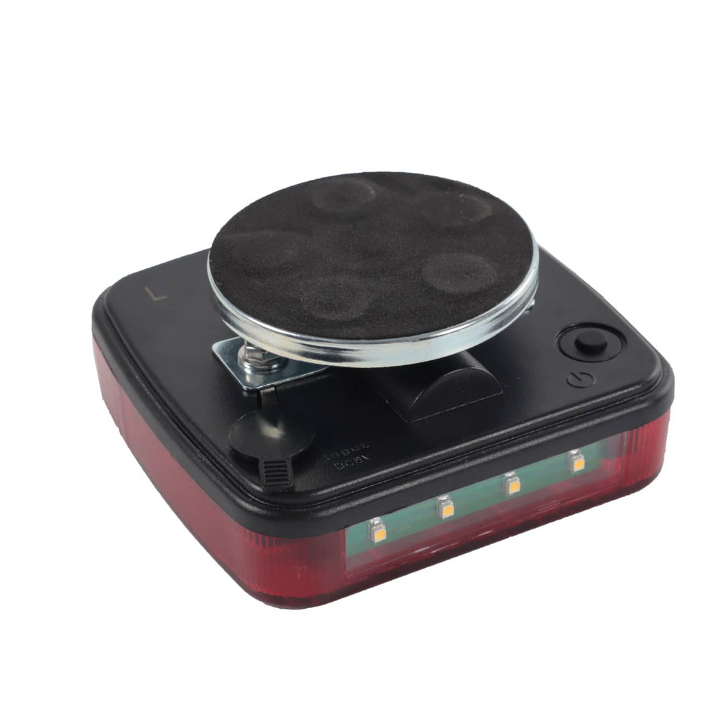 Magnetic LED trailer light with red lens, circular top magnet, and mounting base